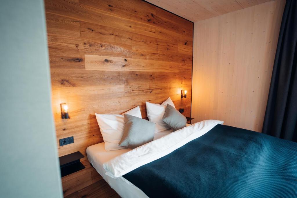 Postel nebo postele na pokoji v ubytování Pur-INN das Gästehaus