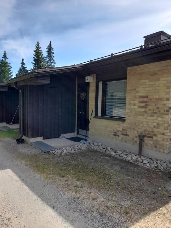 a house with a door on the side of it at Laaksotie in Heinävesi