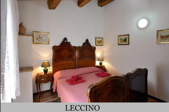 A bed or beds in a room at Le Gorghe di Valmarino