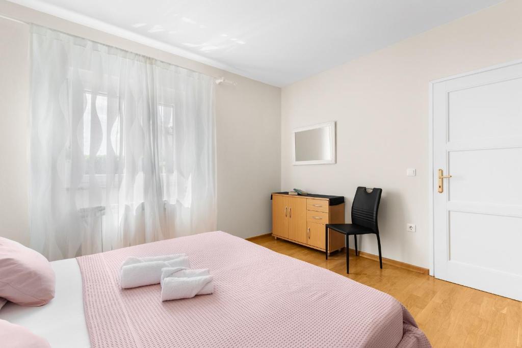 Łóżko lub łóżka w pokoju w obiekcie Villa Hope Apartments