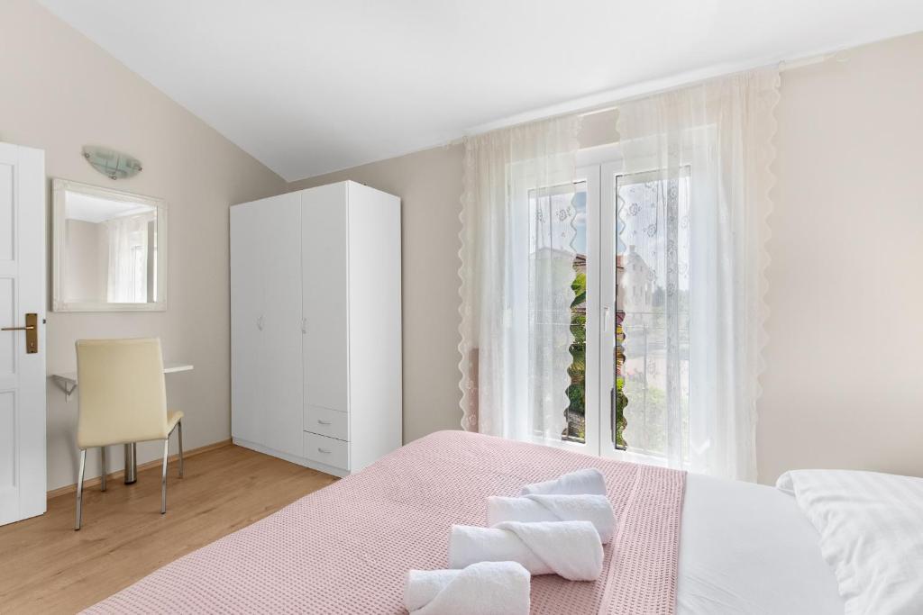 Łóżko lub łóżka w pokoju w obiekcie Villa Hope Apartments