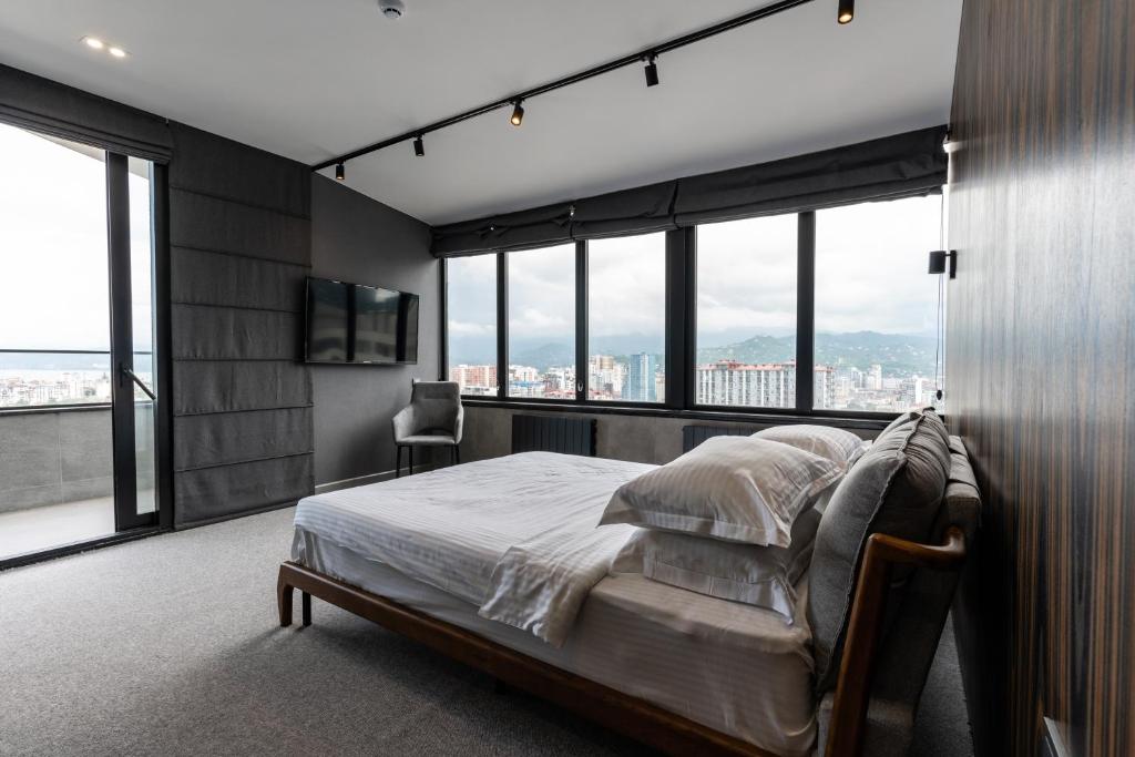 Postel nebo postele na pokoji v ubytování Gumbati Apart Hotel
