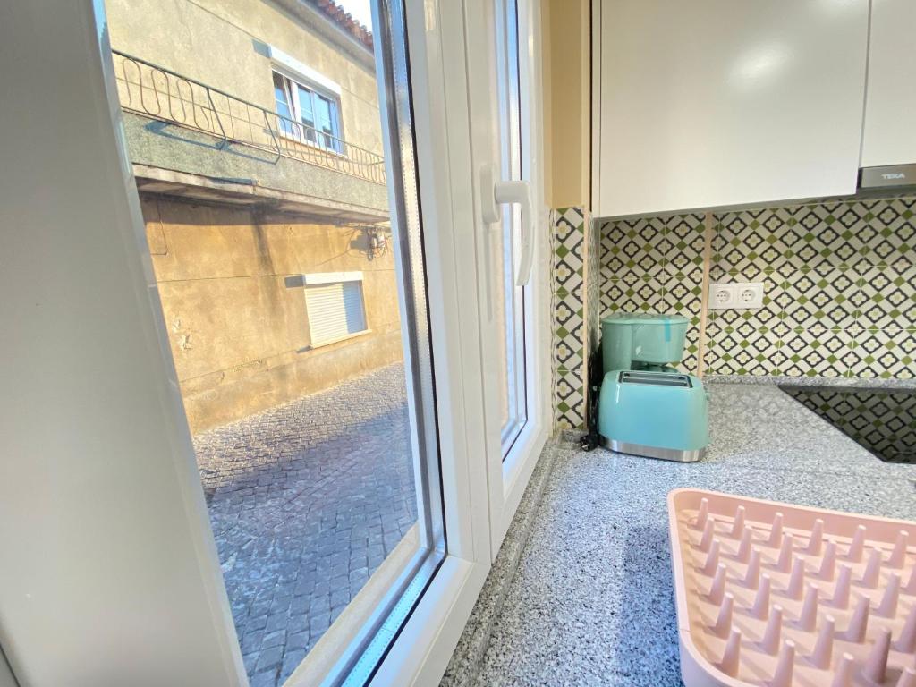Postel nebo postele na pokoji v ubytování Palmela Downtown Terrace