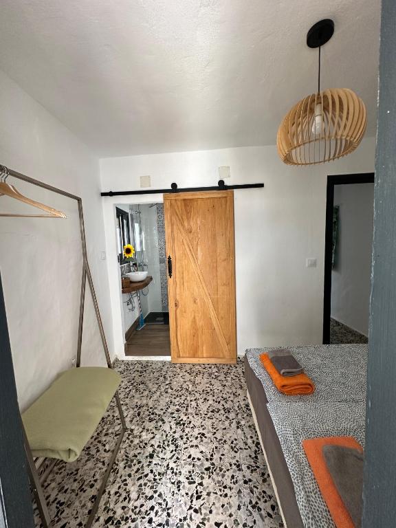Łóżko lub łóżka w pokoju w obiekcie Villa Beso Casa Rural
