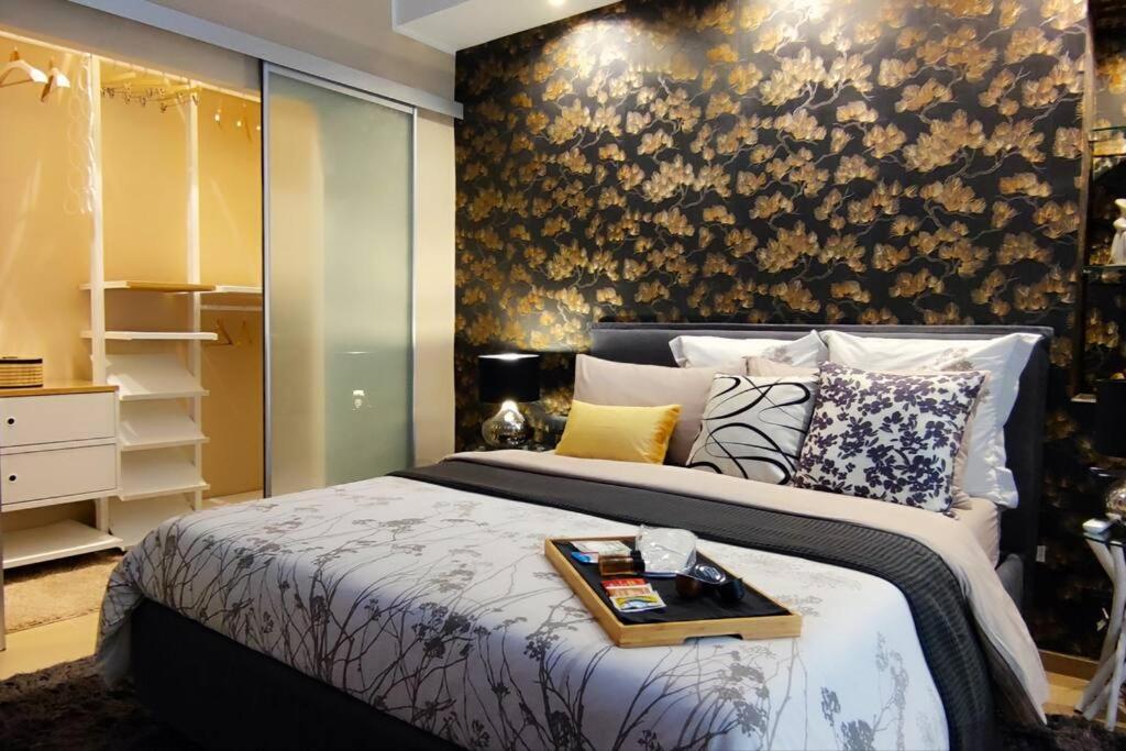 a bedroom with a bed with a tray on it at Casa Relax - 500 mt. dal Centro in Turin