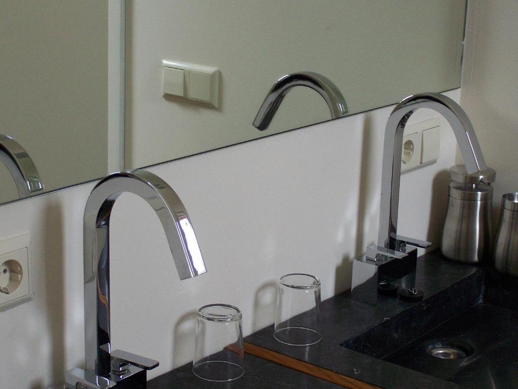 Een keuken of kitchenette bij Hotel het Oude Postkantoor