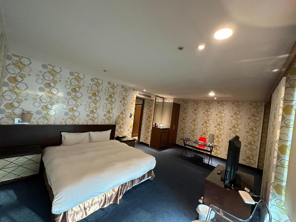Postel nebo postele na pokoji v ubytování 喜客商旅 Seeker Hotel - Sanchong