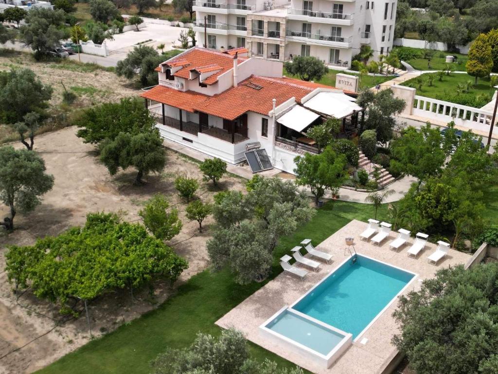 an aerial view of a house with a swimming pool at Sunny Countryside Villa - With private pool in Faliraki