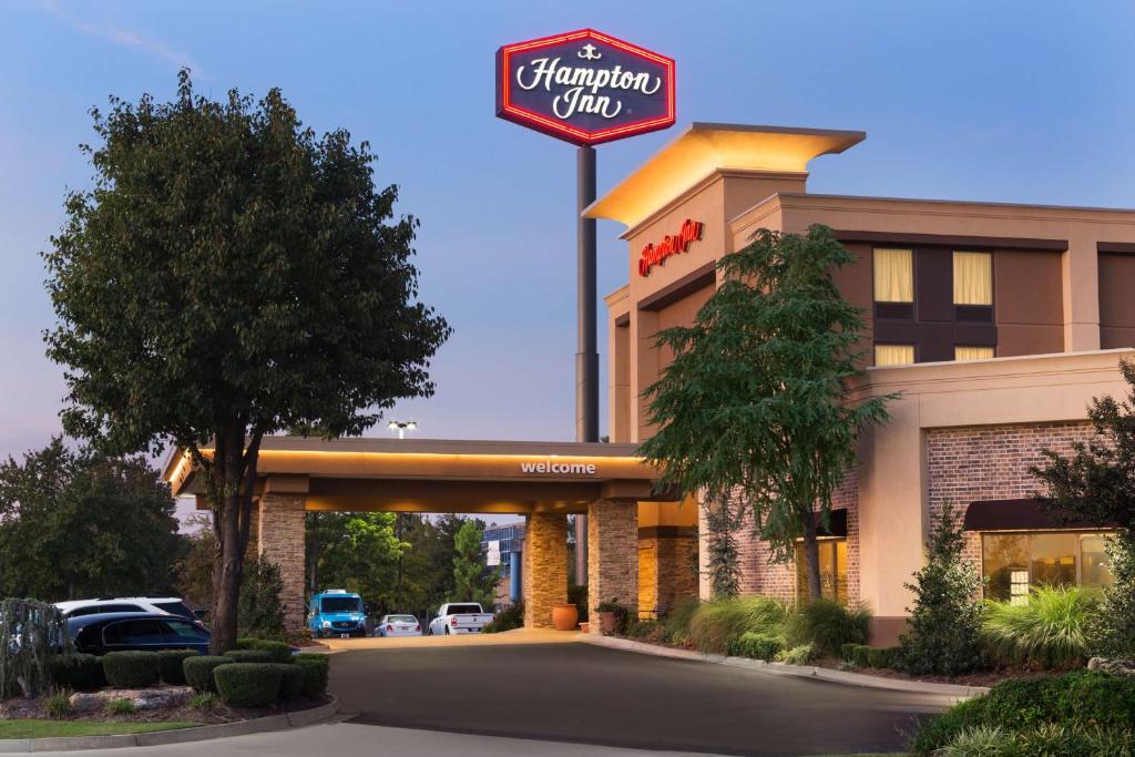 a sign for a hampton inn with a parking lot at Hampton Inn by Hilton Fort Smith in Fort Smith