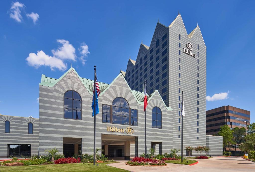 a rendering of the exterior of a hotel at Hilton Houston North in Houston