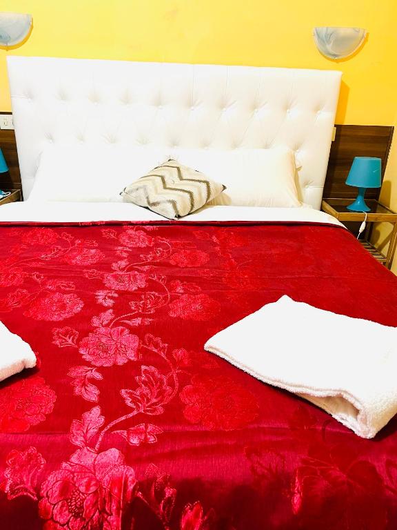 Posteľ alebo postele v izbe v ubytovaní Magenta Roma house