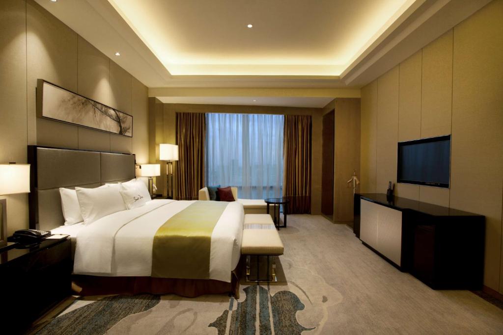 Postel nebo postele na pokoji v ubytování DoubleTree by Hilton Heyuan