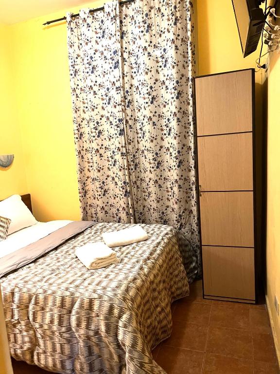 Posteľ alebo postele v izbe v ubytovaní Magenta Roma house