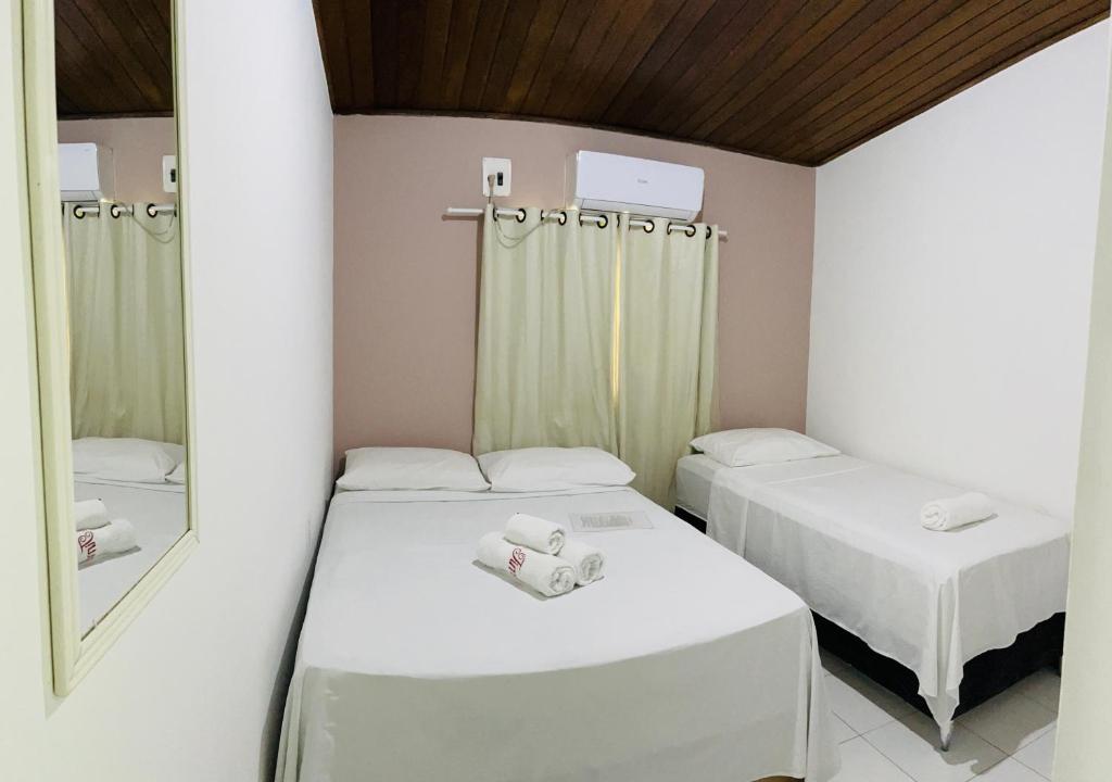 Postel nebo postele na pokoji v ubytování Pousada Timbalada
