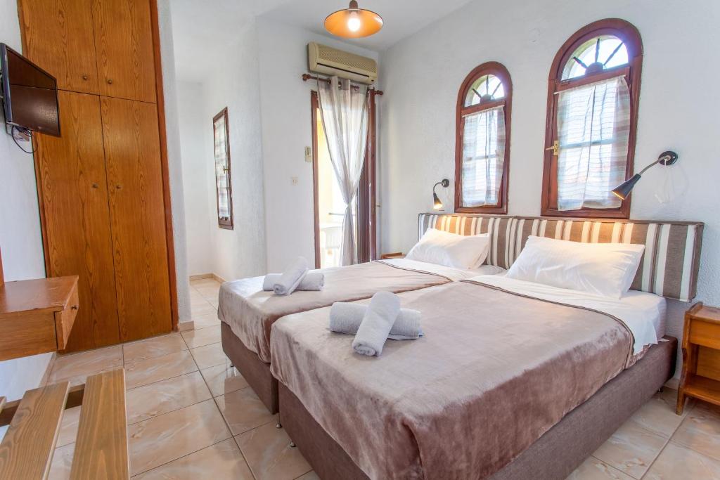 Postel nebo postele na pokoji v ubytování Villa Kalliopi