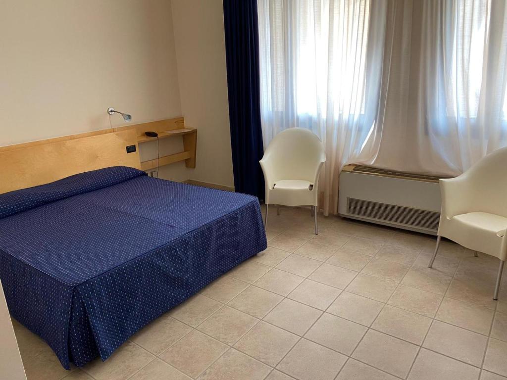Postel nebo postele na pokoji v ubytování Albergo Ristorante Saverino