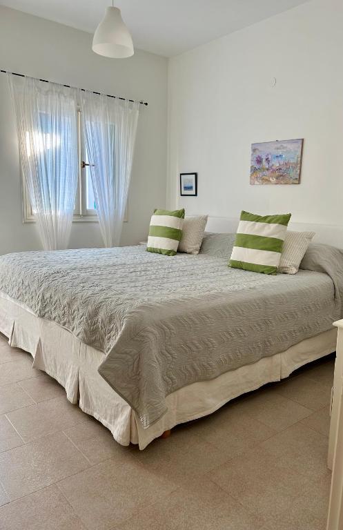Postel nebo postele na pokoji v ubytování Casa Di Lika