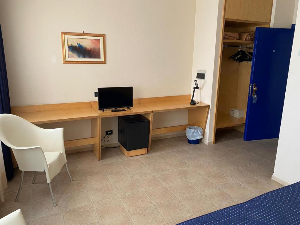 TV a/nebo společenská místnost v ubytování Albergo Ristorante Saverino
