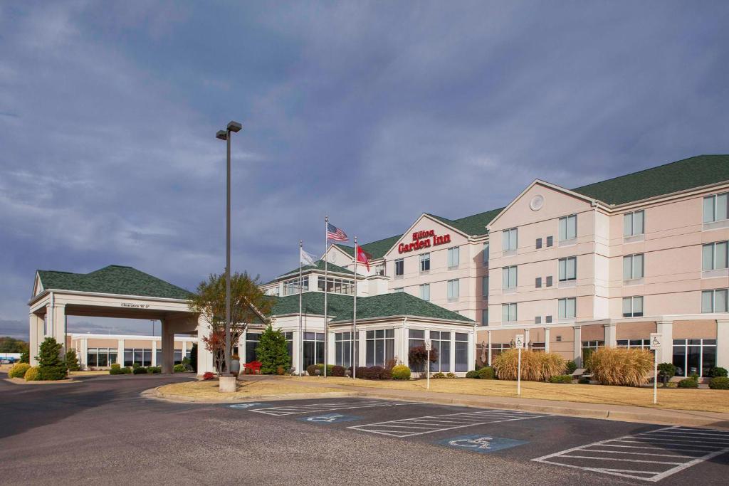 a hotel with a parking lot in front of it at Hilton Garden Inn Jonesboro in Jonesboro