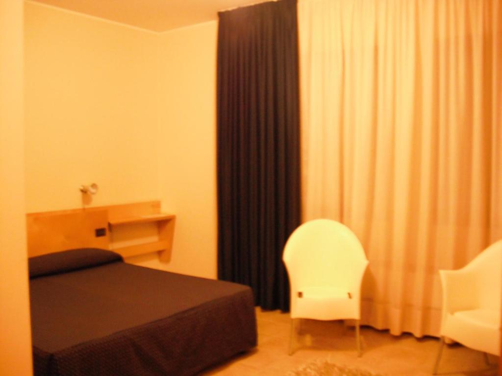 Postel nebo postele na pokoji v ubytování Albergo Ristorante Saverino