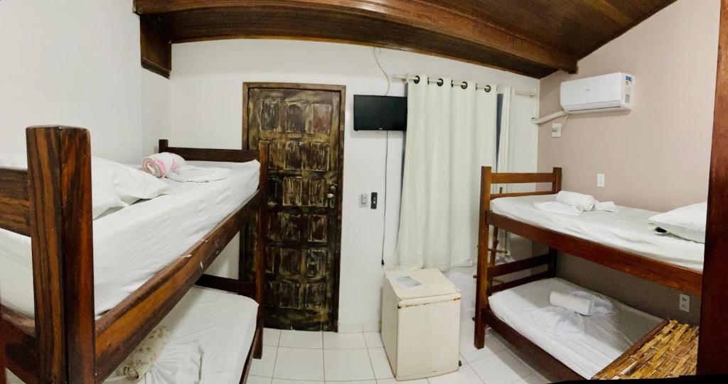 Postel nebo postele na pokoji v ubytování Pousada Timbalada