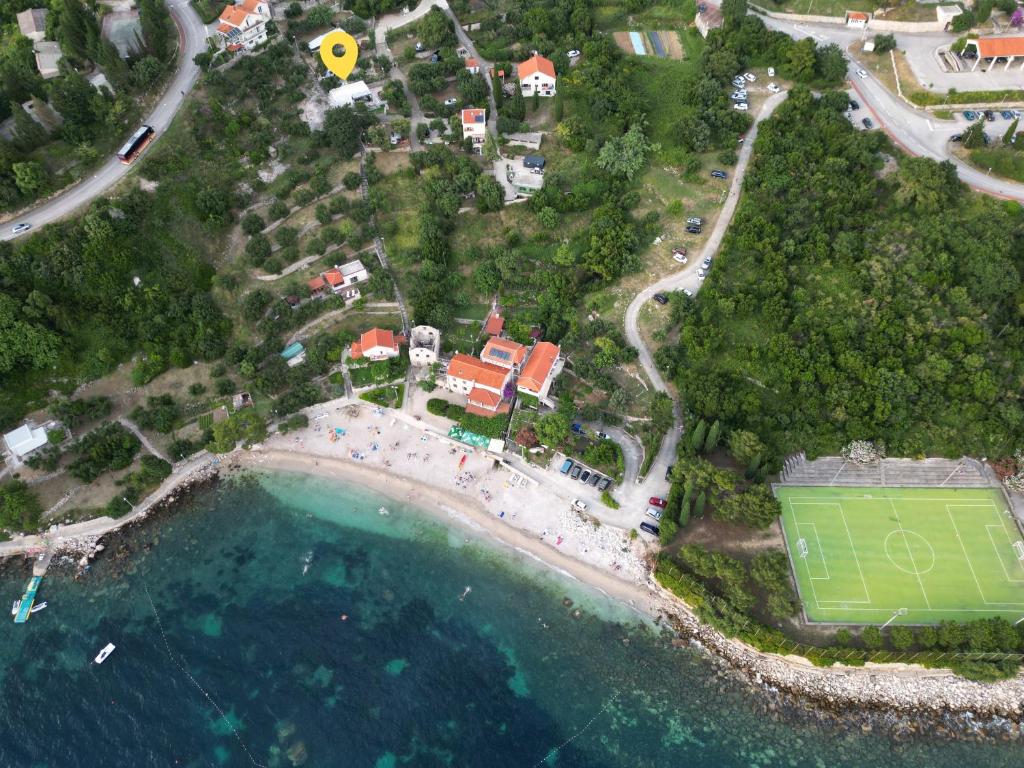 an aerial view of a soccer field next to the water at Summerhouse Liber in Mlini