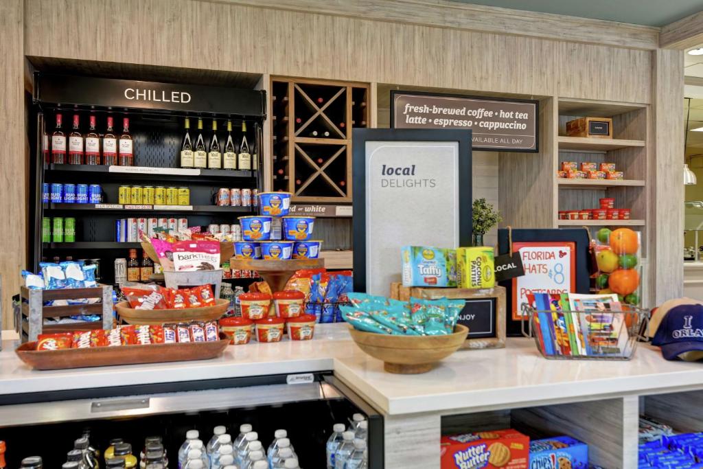a store with food and drinks on a counter at Hilton Garden Inn Orlando Lake Buena Vista in Orlando