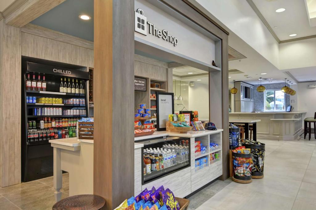 a grocery store aisle with a grocery store at Hilton Garden Inn Orlando Lake Buena Vista in Orlando