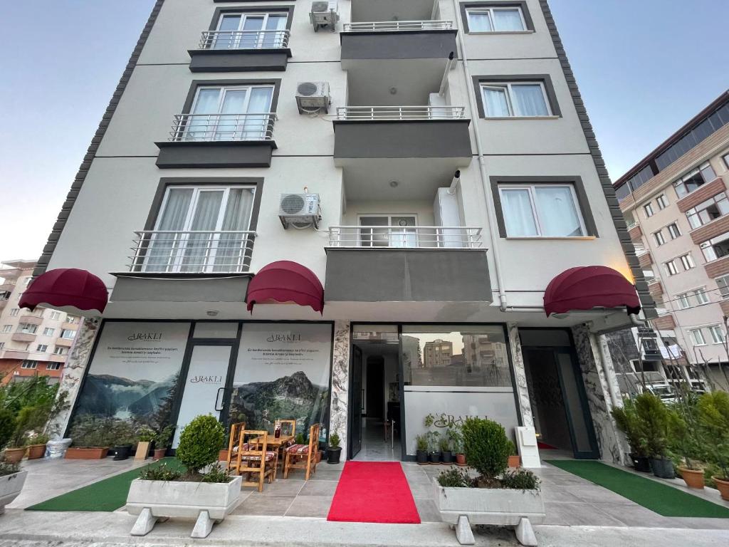 a building with a red carpet in front of it at Araklı Residence in Araklı