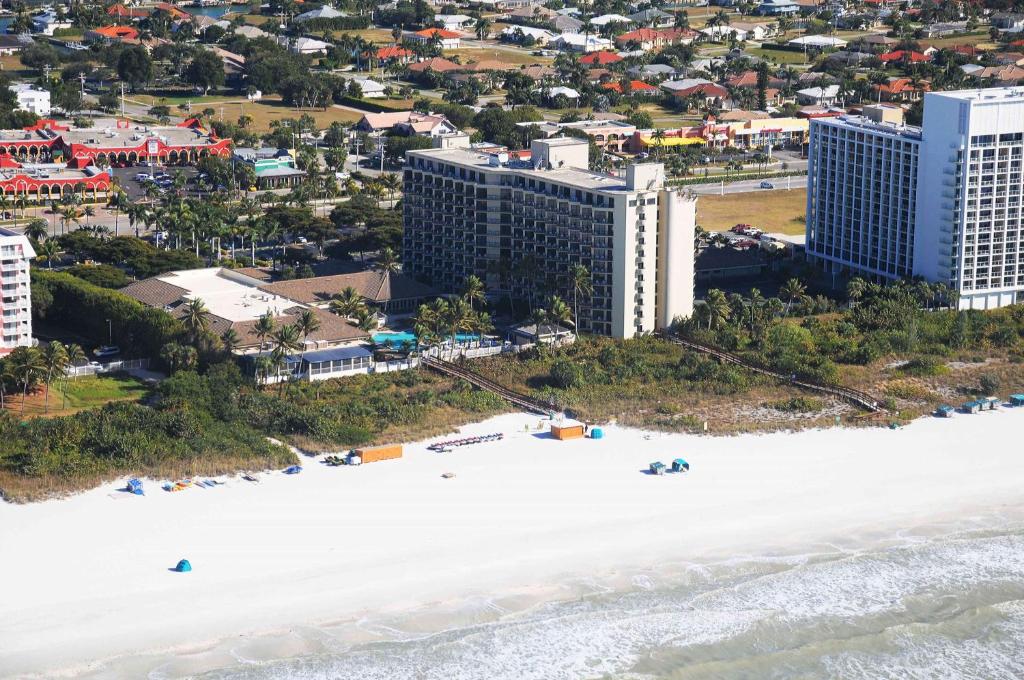 an aerial view of the beach and buildings at Hilton Marco Island Beach Resort and Spa in Marco Island