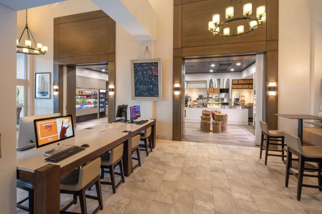 a lobby with a desk with a computer on it at Hilton Marco Island Beach Resort and Spa in Marco Island