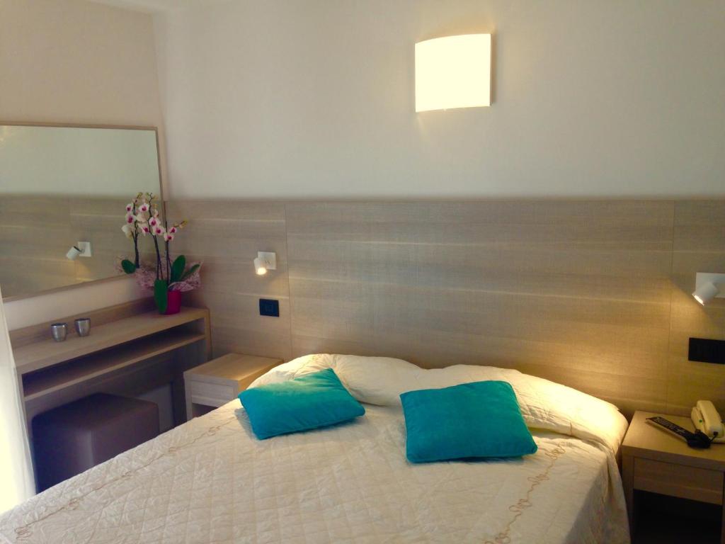Postel nebo postele na pokoji v ubytování Hotel Daniela