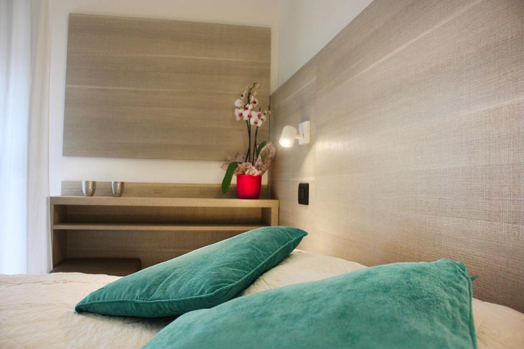 Postel nebo postele na pokoji v ubytování Hotel Daniela