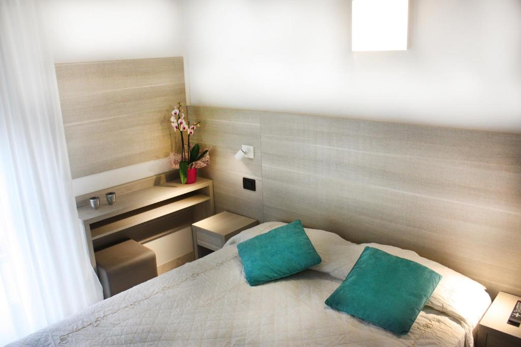 Postel nebo postele na pokoji v ubytování Hotel Daniela