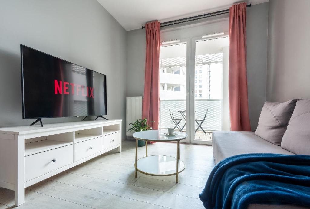 Televízia a/alebo spoločenská miestnosť v ubytovaní apartamenty-wroc Atal Towers