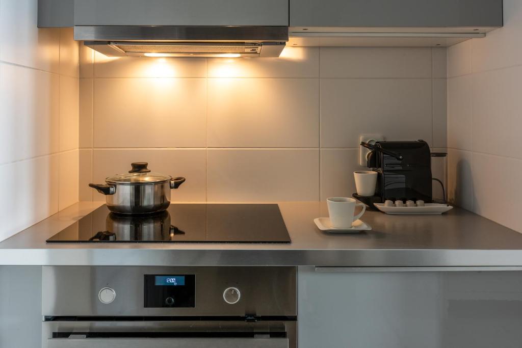 Kuchyňa alebo kuchynka v ubytovaní apartamenty-wroc Atal Towers