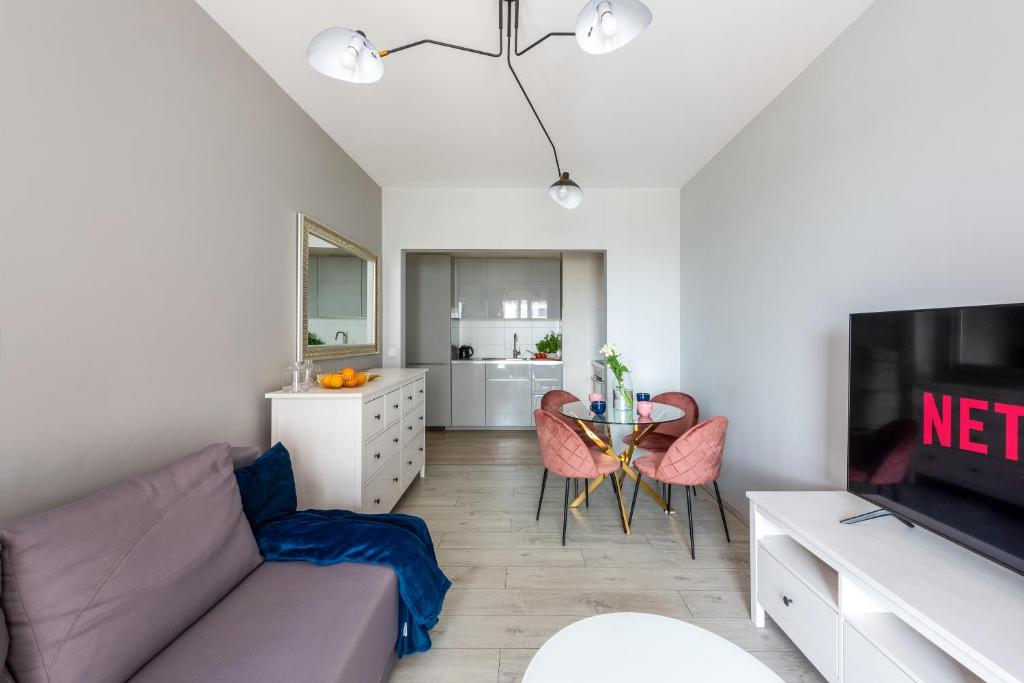 Televízia a/alebo spoločenská miestnosť v ubytovaní apartamenty-wroc Atal Towers