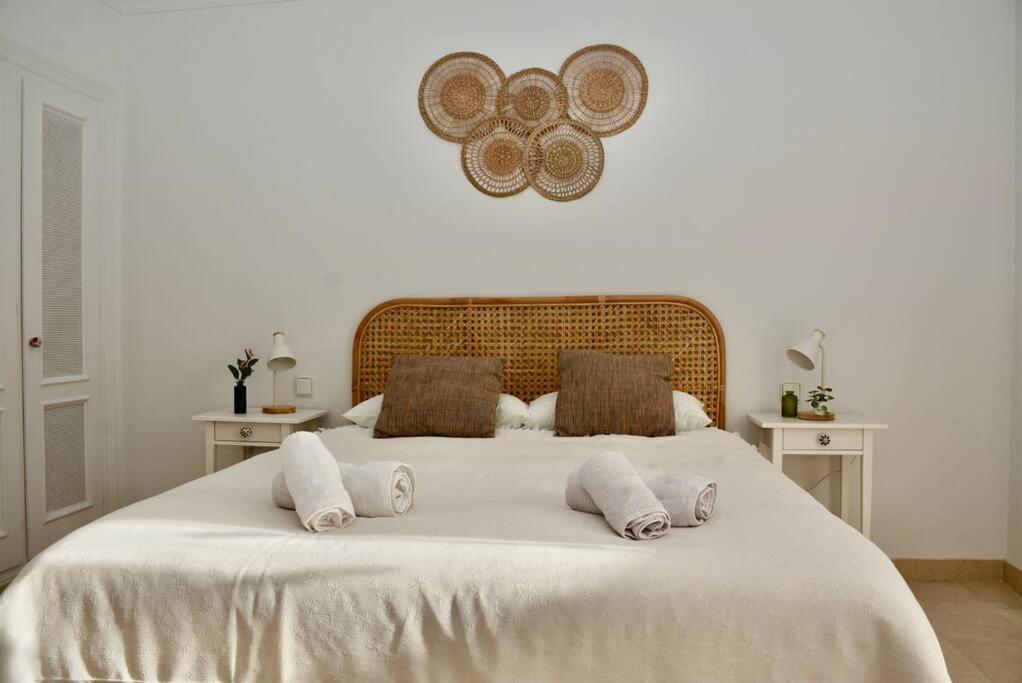 a white bed with two pillows on top of it at Golfer Paradise next to La Quinta Golf Club RDR319 in Benahavís