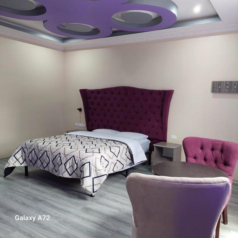 Postel nebo postele na pokoji v ubytování Hostal Kapital II