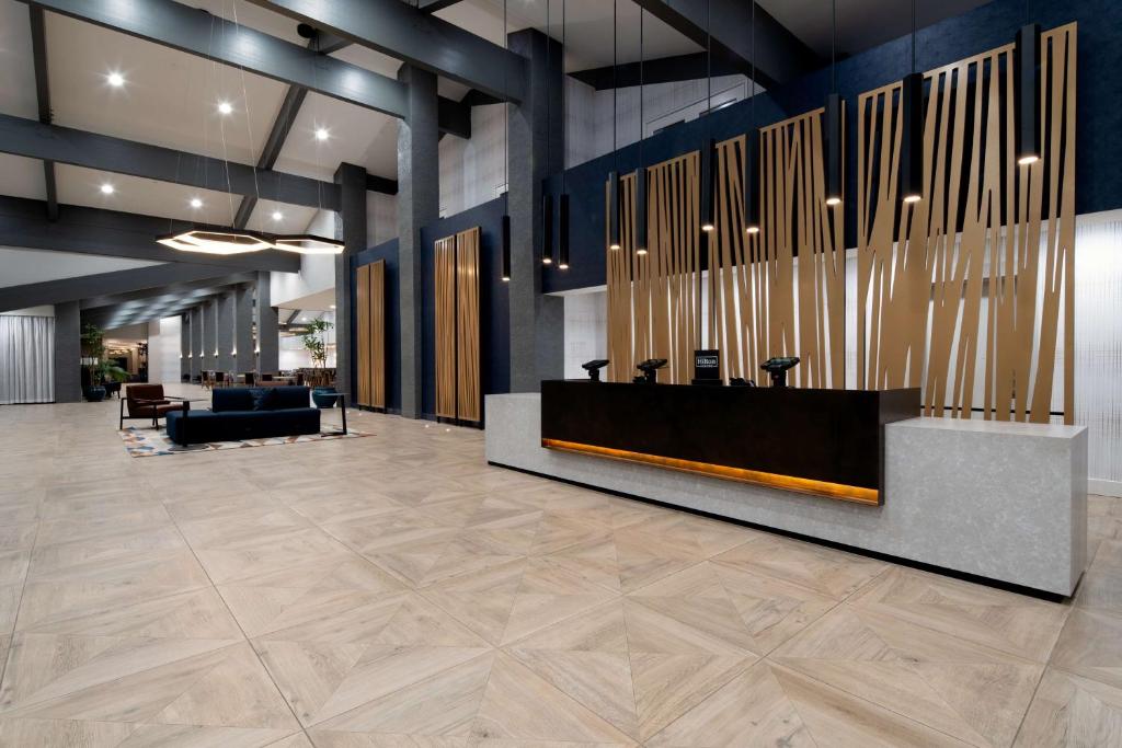 a lobby with a large organ in a building at DoubleTree by Hilton Bakersfield in Bakersfield