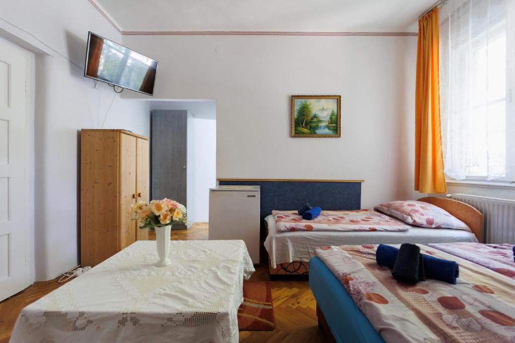Postel nebo postele na pokoji v ubytování Balaton Panzió