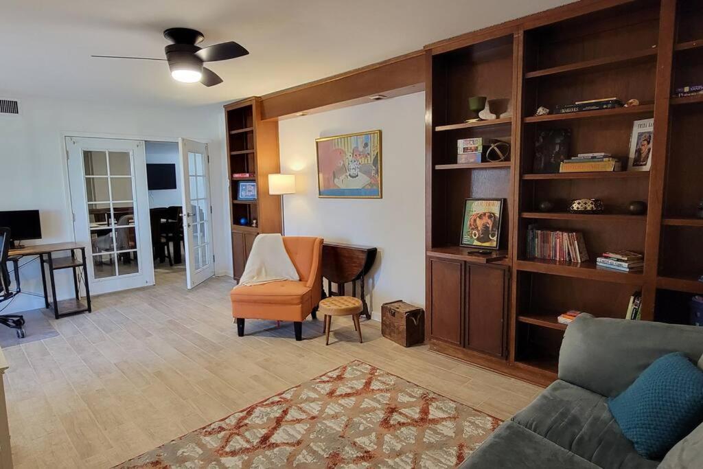 a living room with a couch and a chair and a desk at Casa Sunrise, Large Home, Minutes from Airport, YRMC, Mexico Borders in Yuma