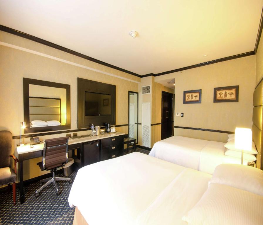 Postel nebo postele na pokoji v ubytování Hilton Princess San Pedro Sula