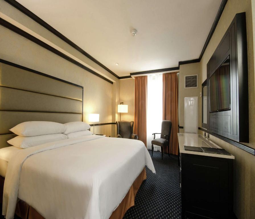 Postel nebo postele na pokoji v ubytování Hilton Princess San Pedro Sula