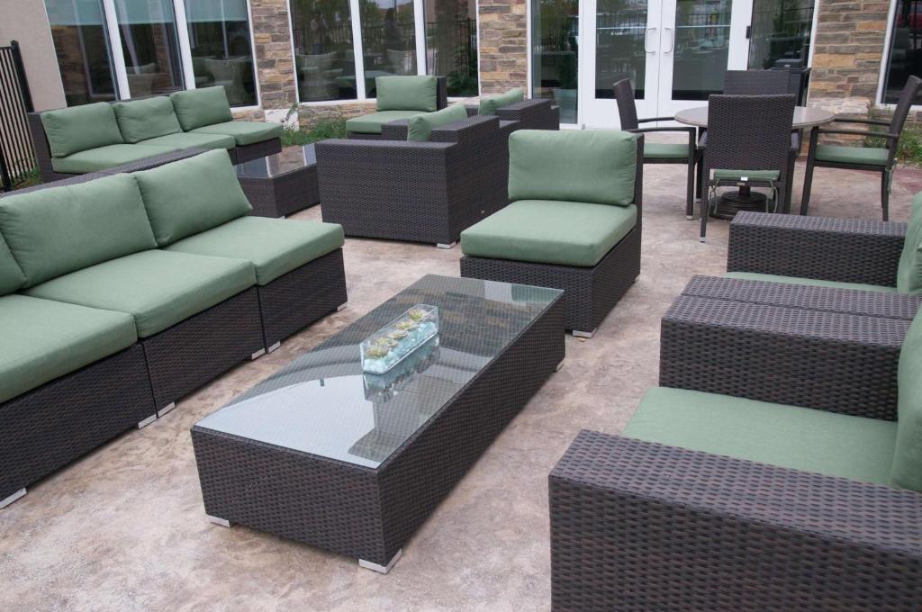 a patio with couches and chairs and a table at Hilton Garden Inn New Braunfels in New Braunfels