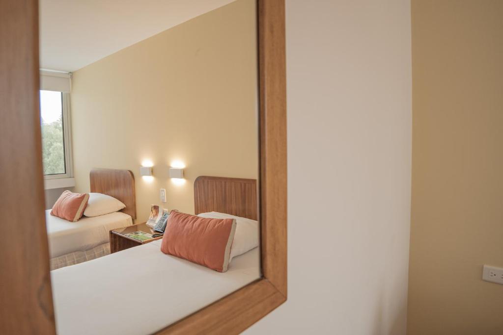 Postel nebo postele na pokoji v ubytování Hotel Ambato