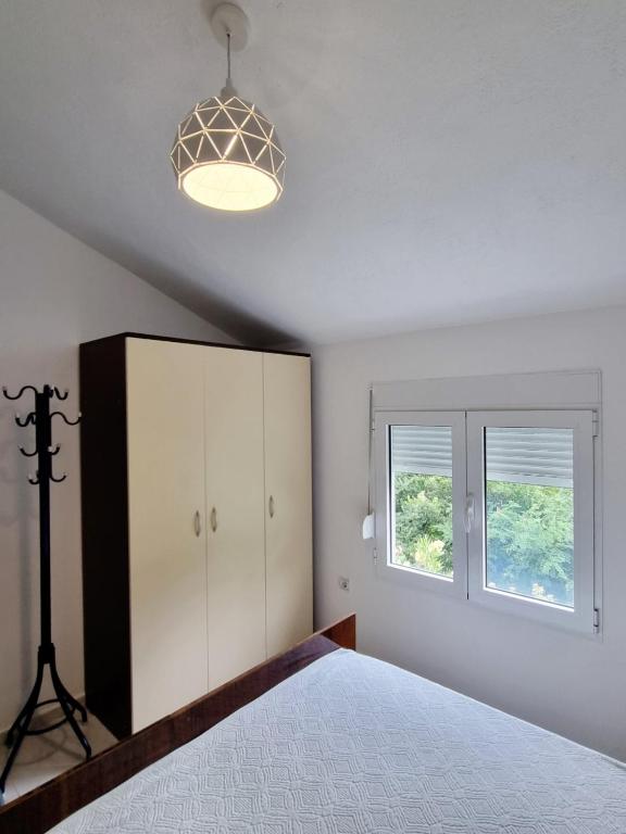 Postel nebo postele na pokoji v ubytování Cozy House Haj Nehaj