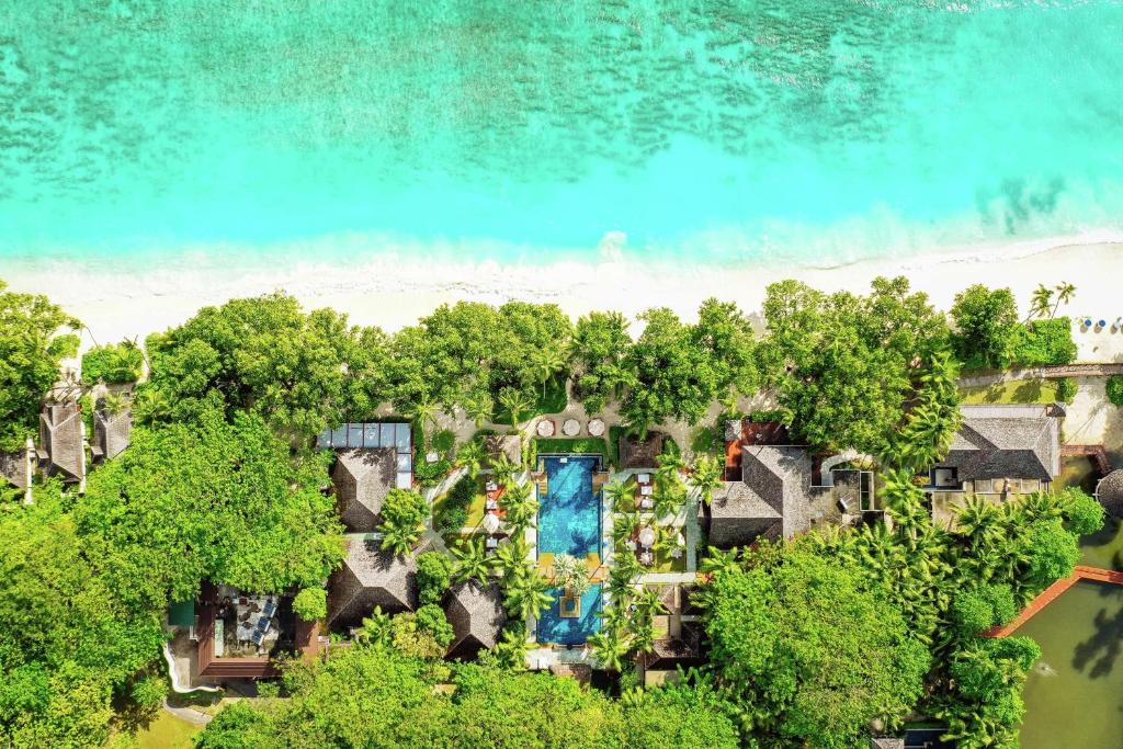 an aerial view of a resort with trees and water at Hilton Seychelles Labriz Resort & Spa in Silhouette Island