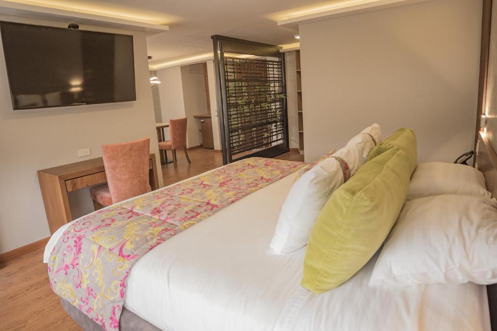 Postel nebo postele na pokoji v ubytování Hotel Ambato
