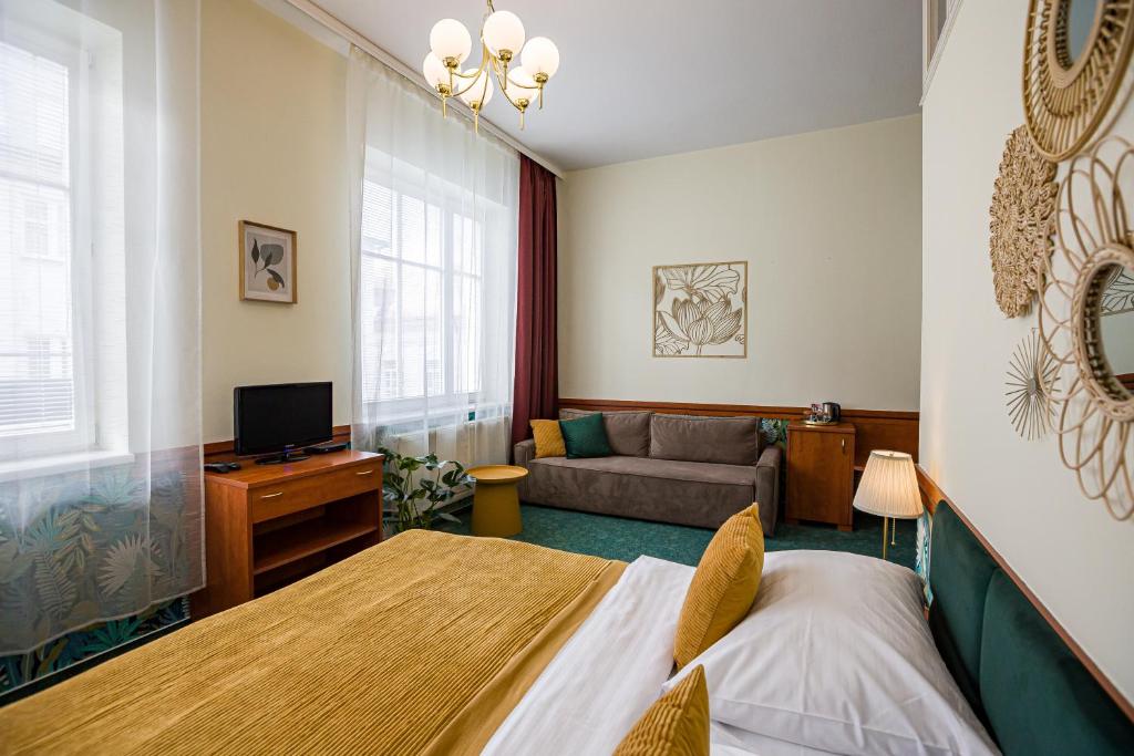 TV a/nebo společenská místnost v ubytování Hotel Arcus Garden